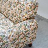 2-seater sofa, floral fabric, wooden structure, plastic and wooden legs, 1970