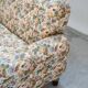2-seater sofa, floral fabric, wooden structure, plastic and wooden legs, 1970