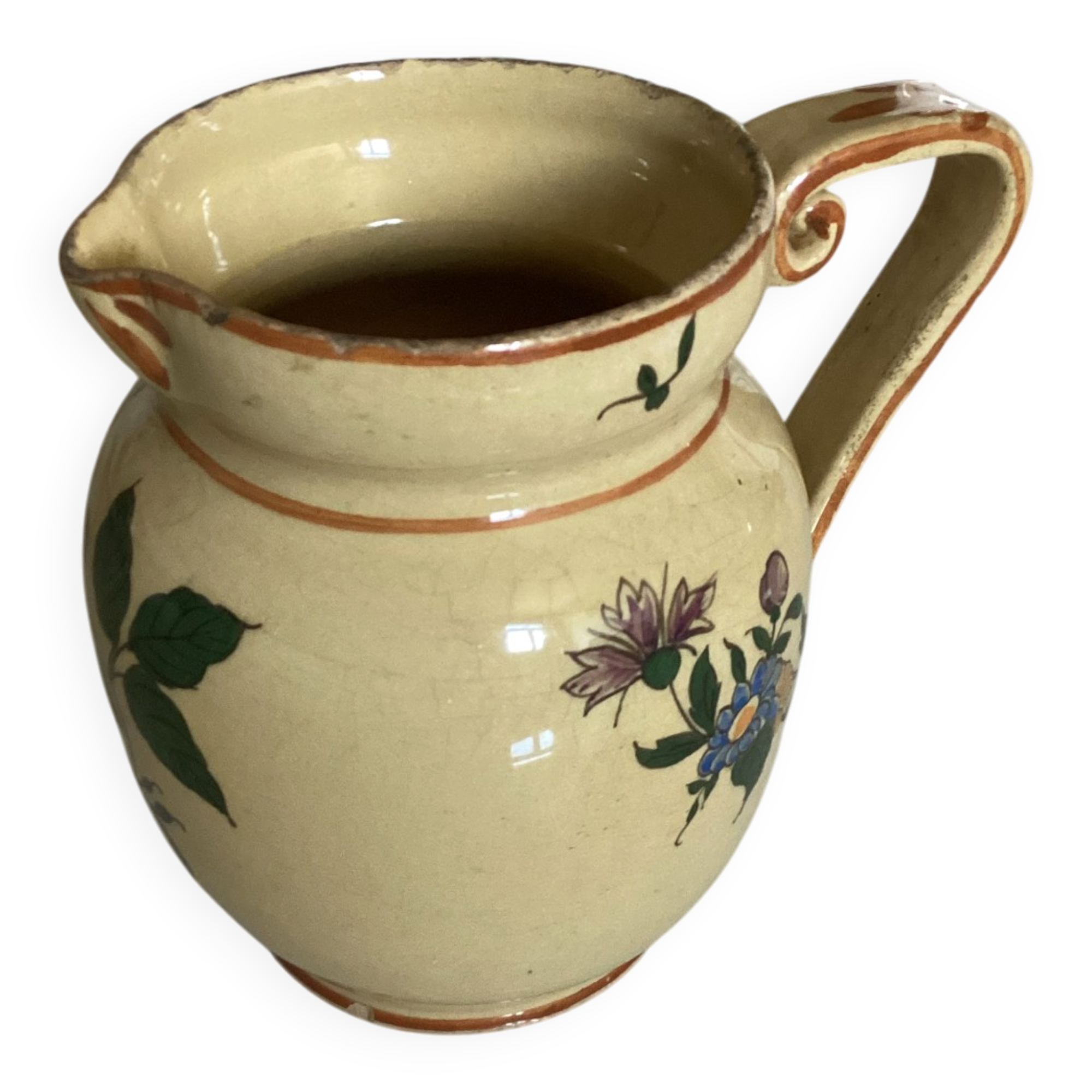 Old ceramic jug with floral decoration
