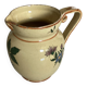 Old ceramic jug with floral decoration