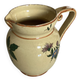 Old ceramic jug with floral decoration