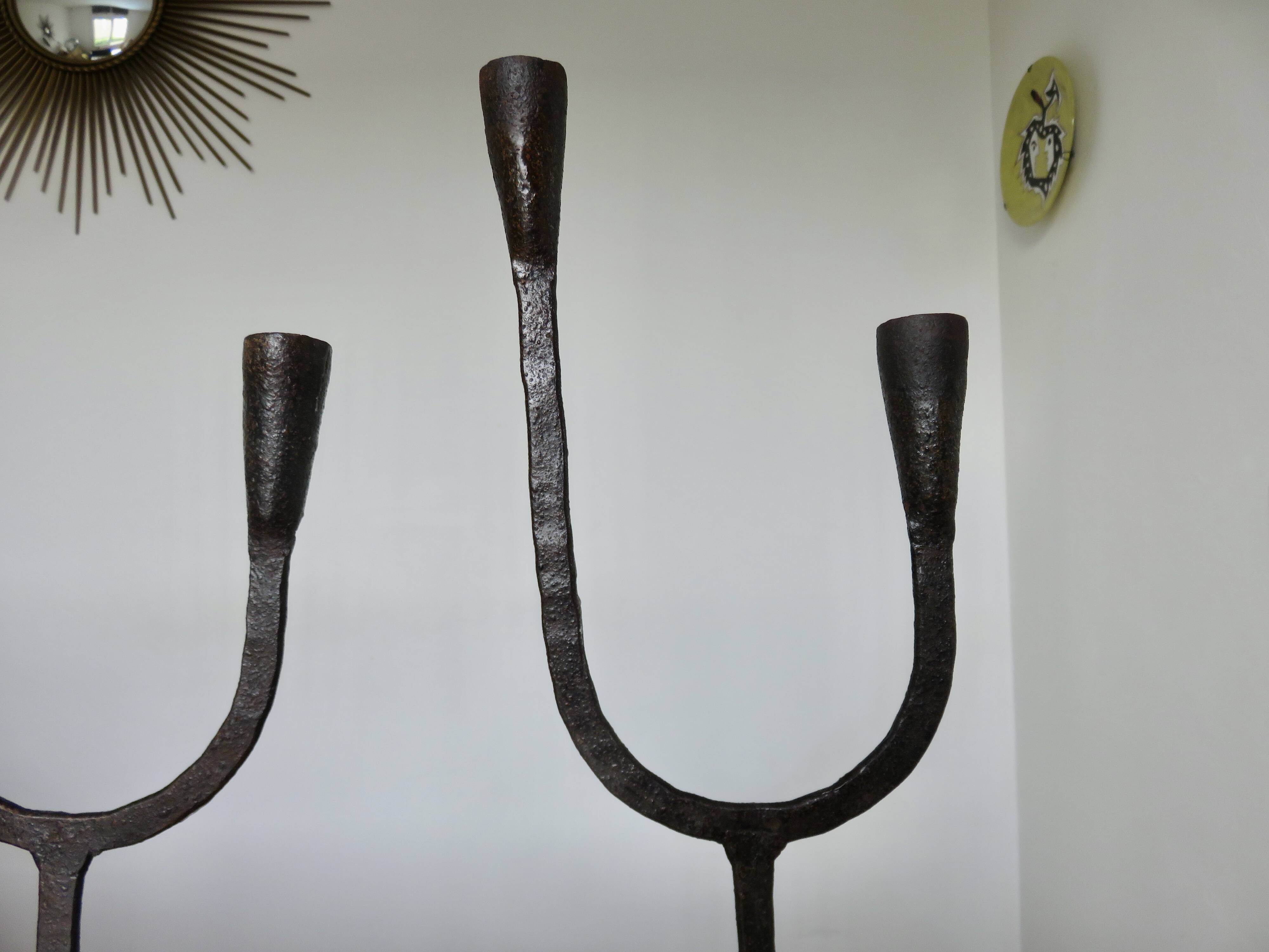 Pair of antique wrought iron candlesticks