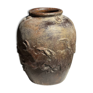 Large traditional Indonesian clay pot featuring a dragon.