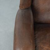 Vintage wingback armchair made of sheepskin leather with beautiful colours