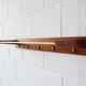 Wall coat rack with hat rack made of teak and gold metal,