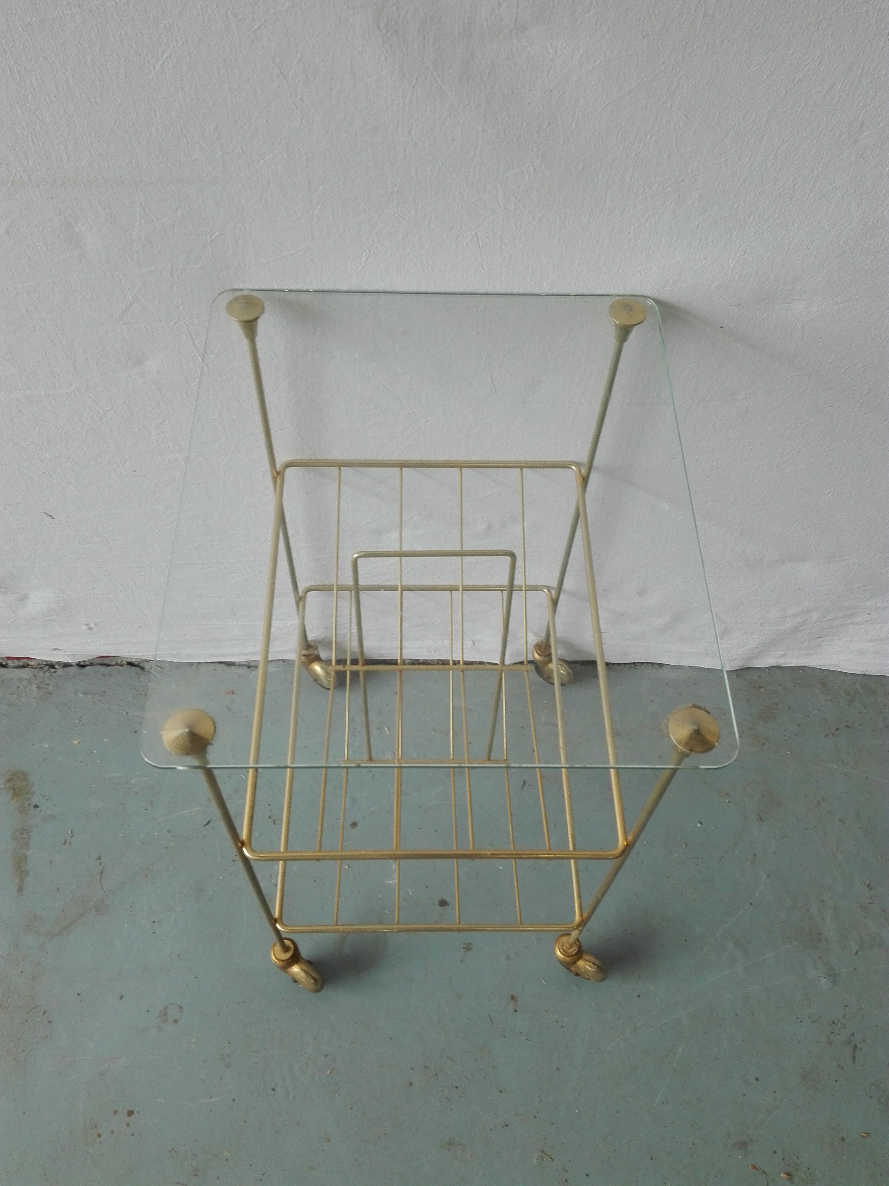 Brass and glass magazine door