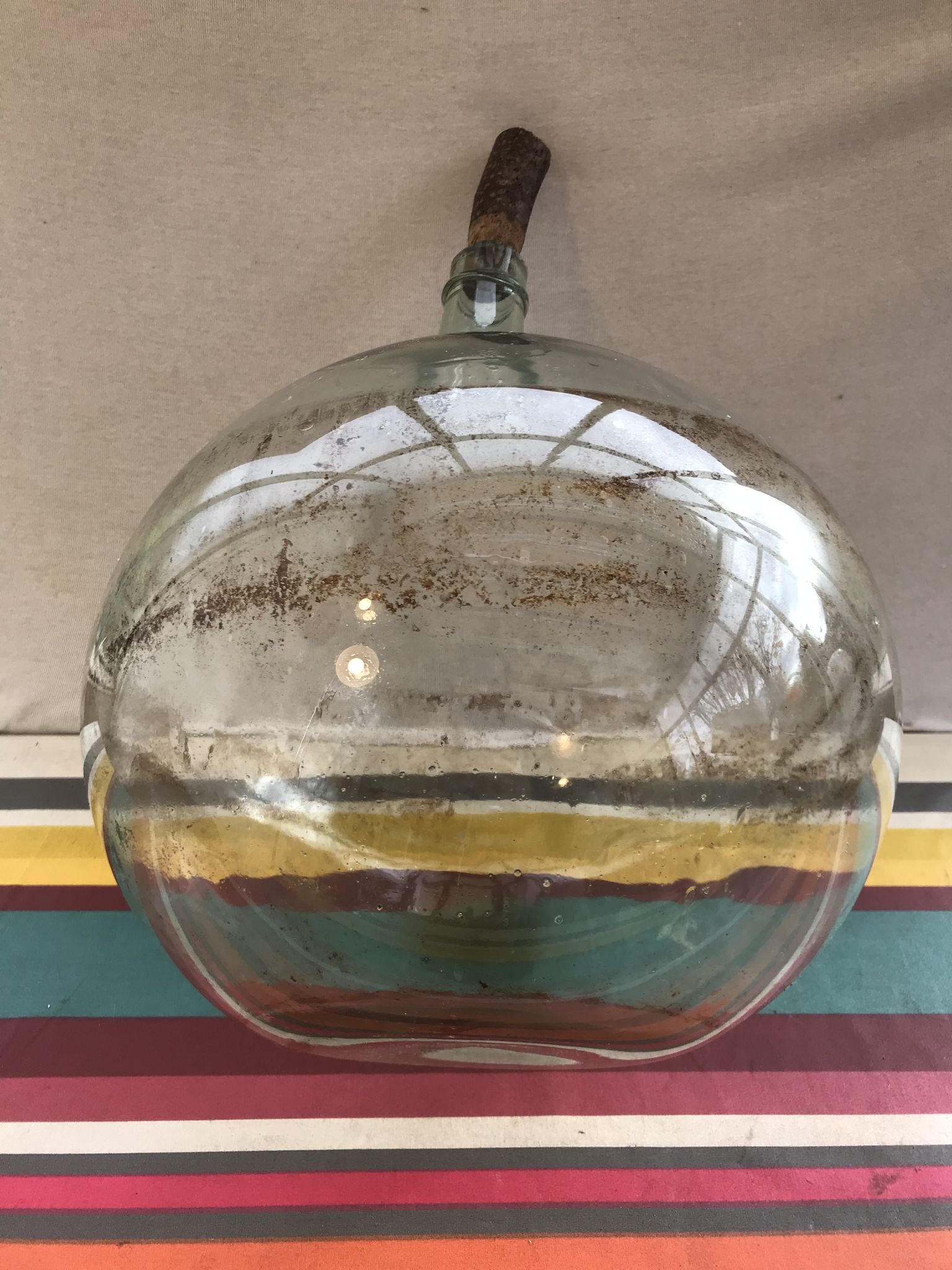Former green glass demijohn