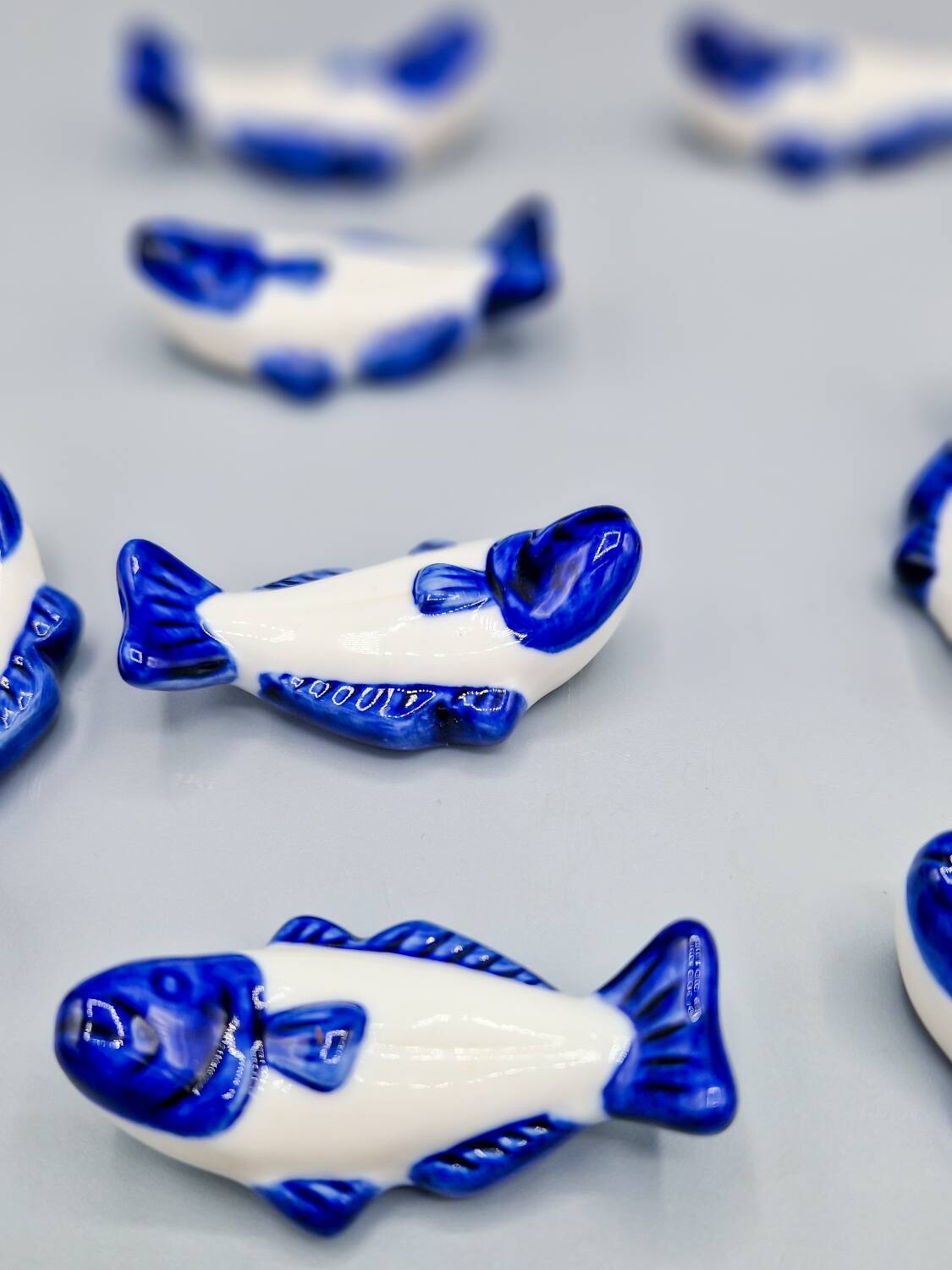 Set of 11 vintage blue and white porcelain fish knife rests.