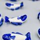 Set of 11 vintage blue and white porcelain fish knife rests.
