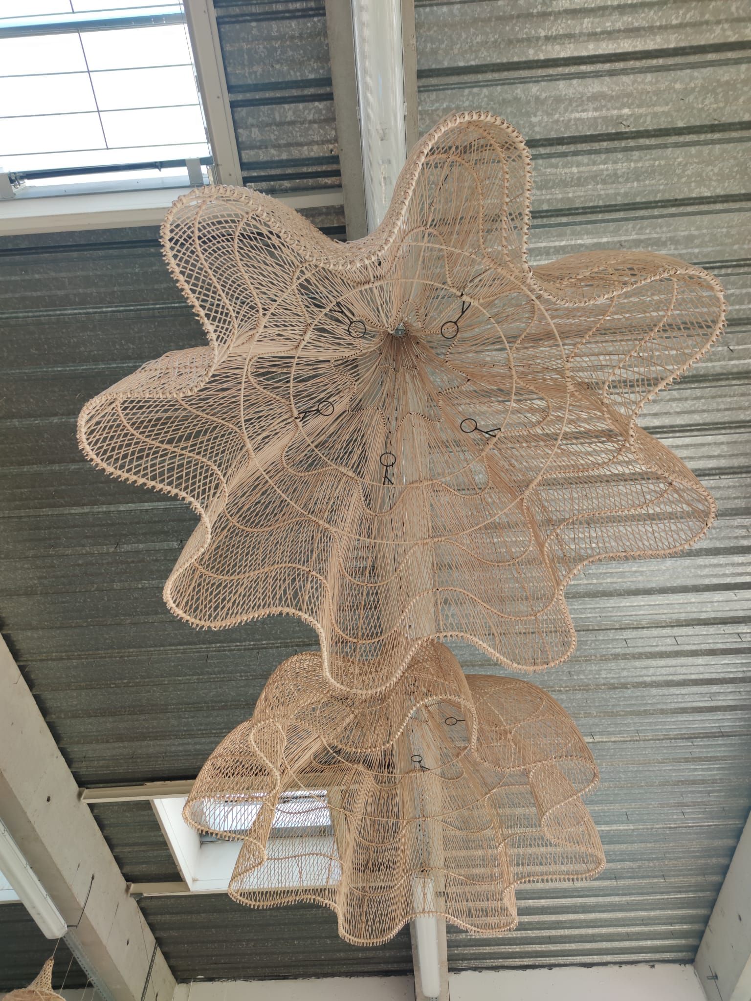 Huge rattan suspension in the shape of a corolla H:1m; D: 1m50