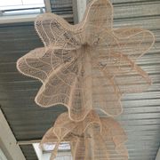 Huge rattan suspension in the shape of a corolla H:1m; D: 1m50