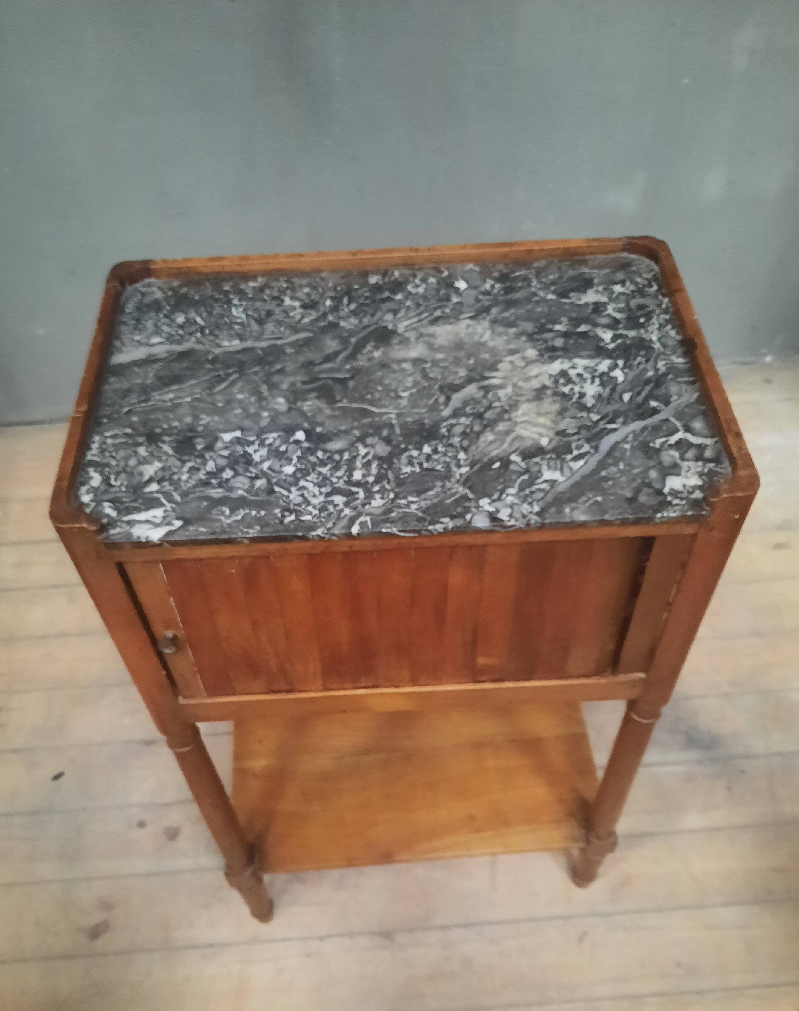 Curtained bedside table from the nineteenth century.