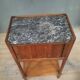 Curtained bedside table from the nineteenth century.