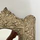 Baroque mirror in repoussé brass
