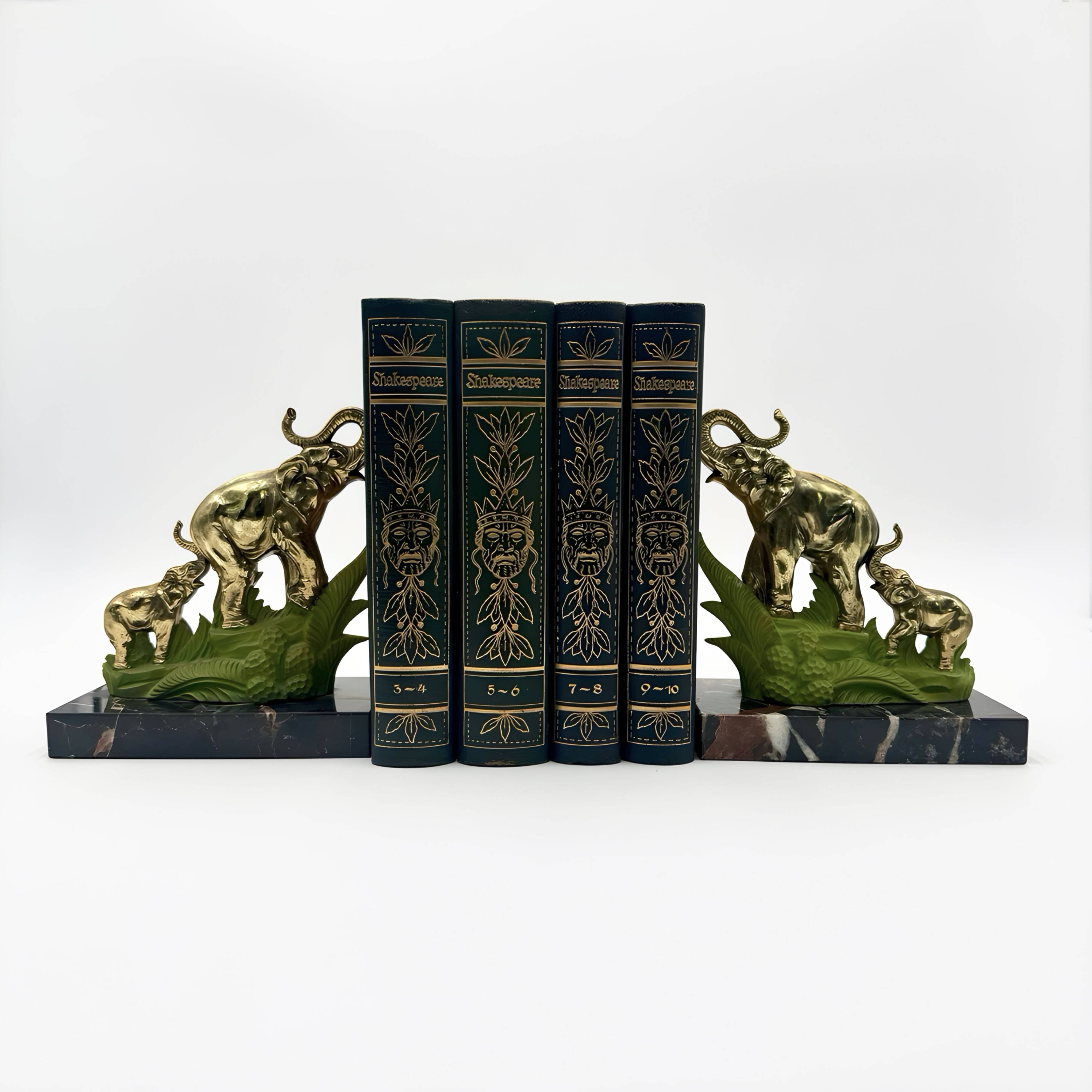Art Deco bookends with elephants in brass and marble.