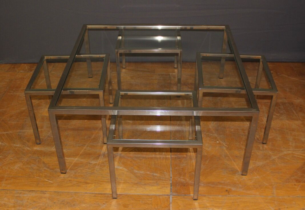 Coffee table and its steel and glass wiggles around 1970
