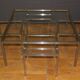 Coffee table and its steel and glass wiggles around 1970
