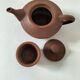 Japanese teapot in red clay engraved with integrated filter.
