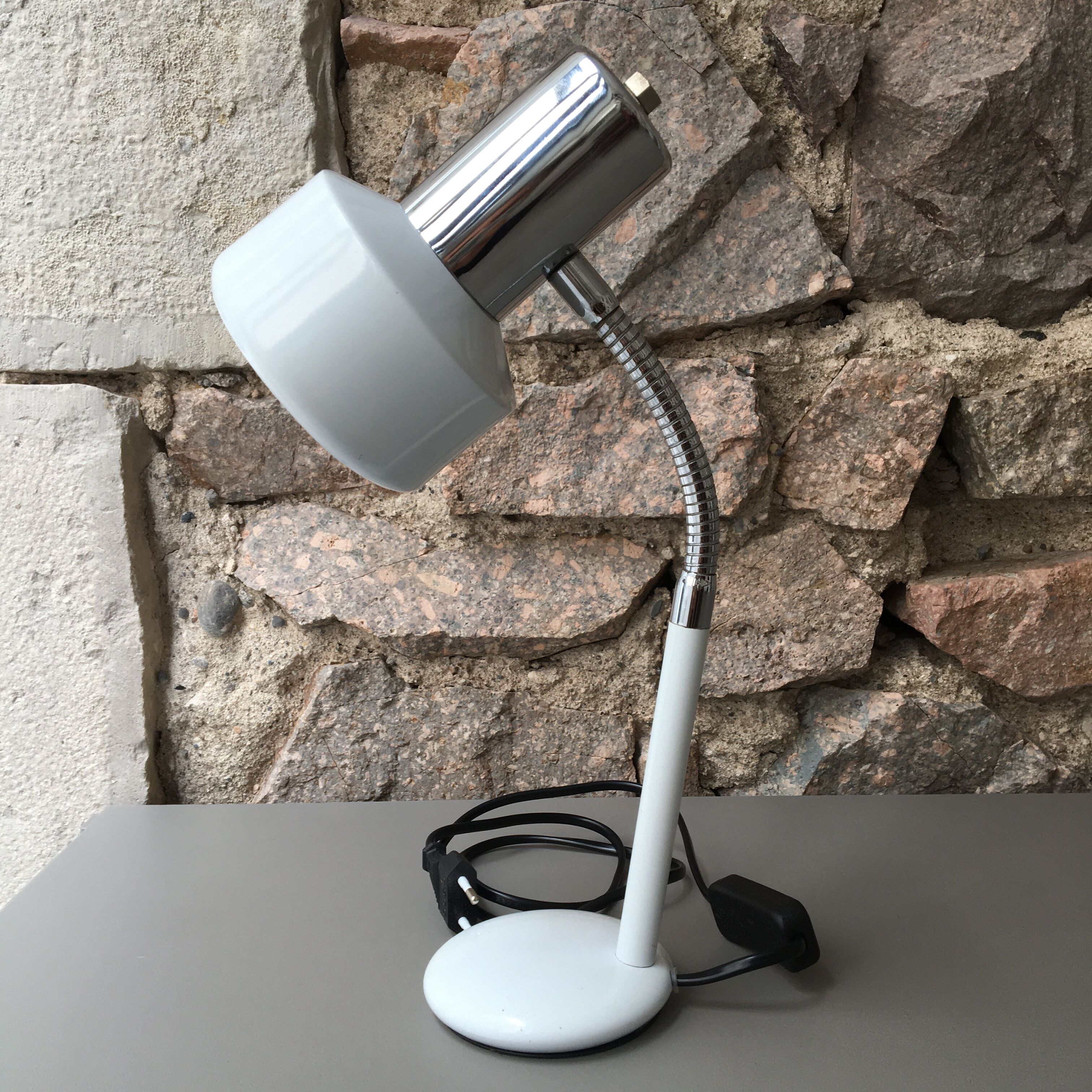 flexible white and stainless steel desk lamp