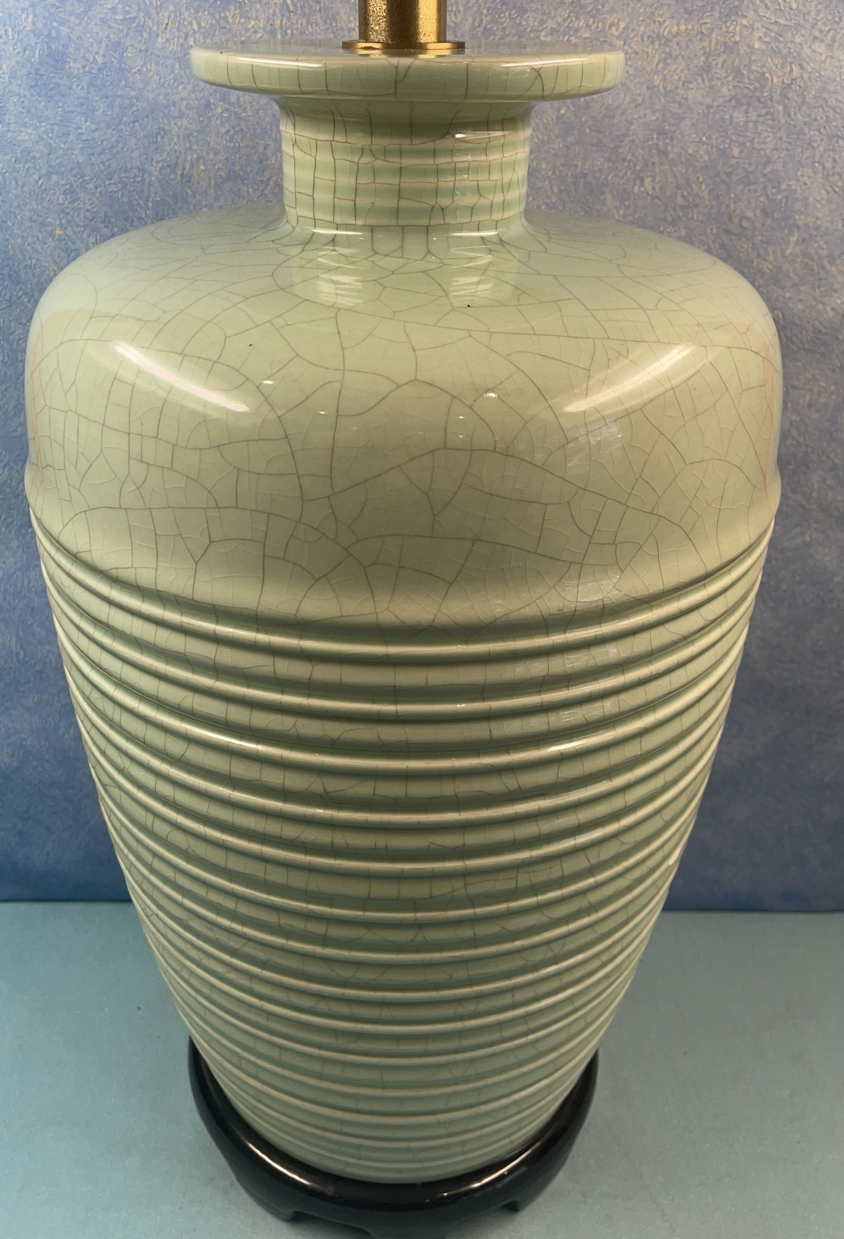 Contemporary ceramic lamp foot in green celadon color to electrify