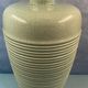 Contemporary ceramic lamp foot in green celadon color to electrify