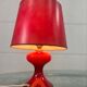 Vintage red table lamp with glass base