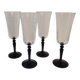 4 clear glass flutes with black stems. 1960–1970. 4 clear glass flutes with black stems.
