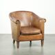 Vintage sheepskin club armchair finished with decorative nails