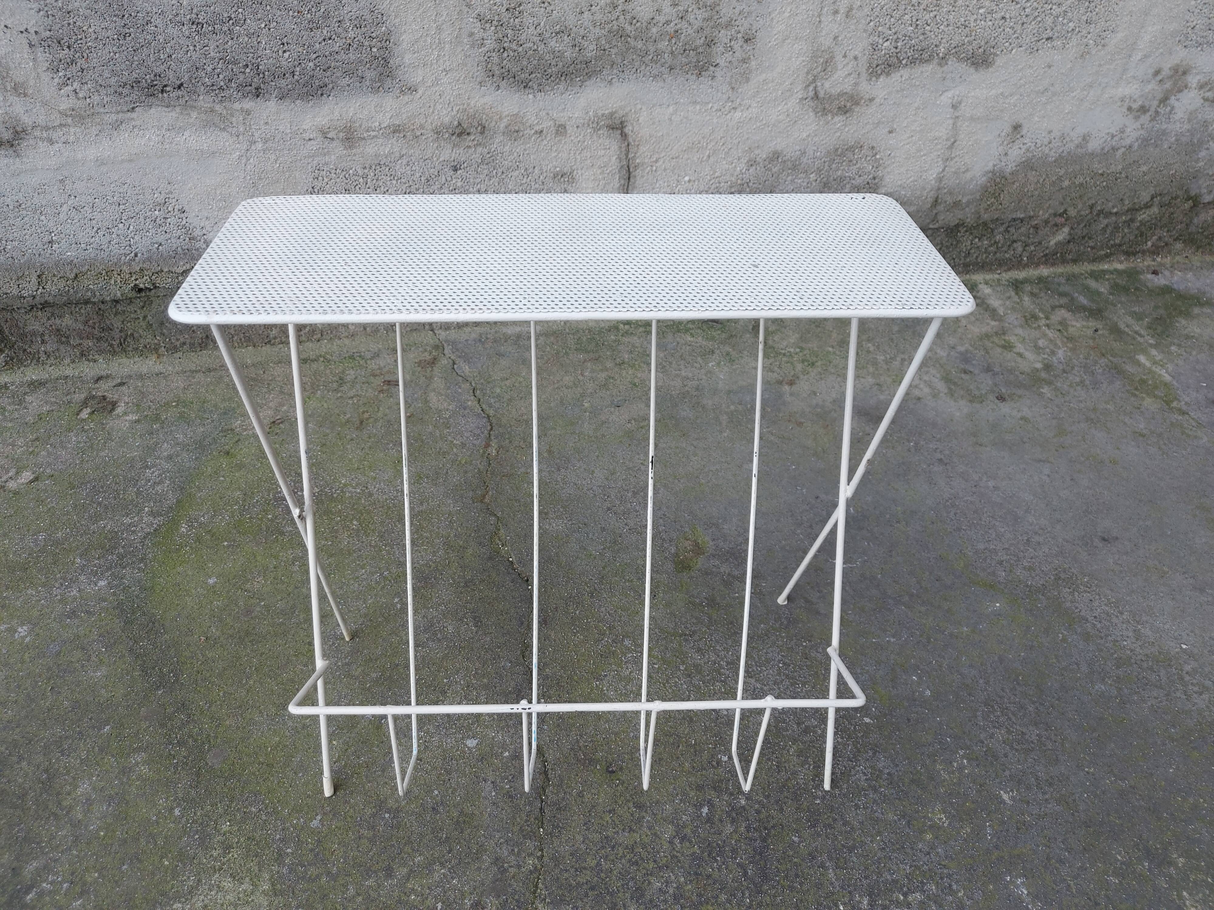 Vintage magazine holder in perforated metal