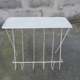 Vintage magazine holder in perforated metal