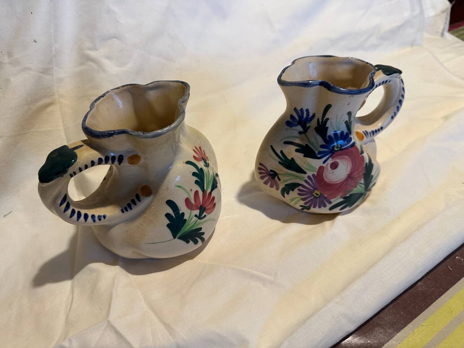 Pair of St Clement pitchers