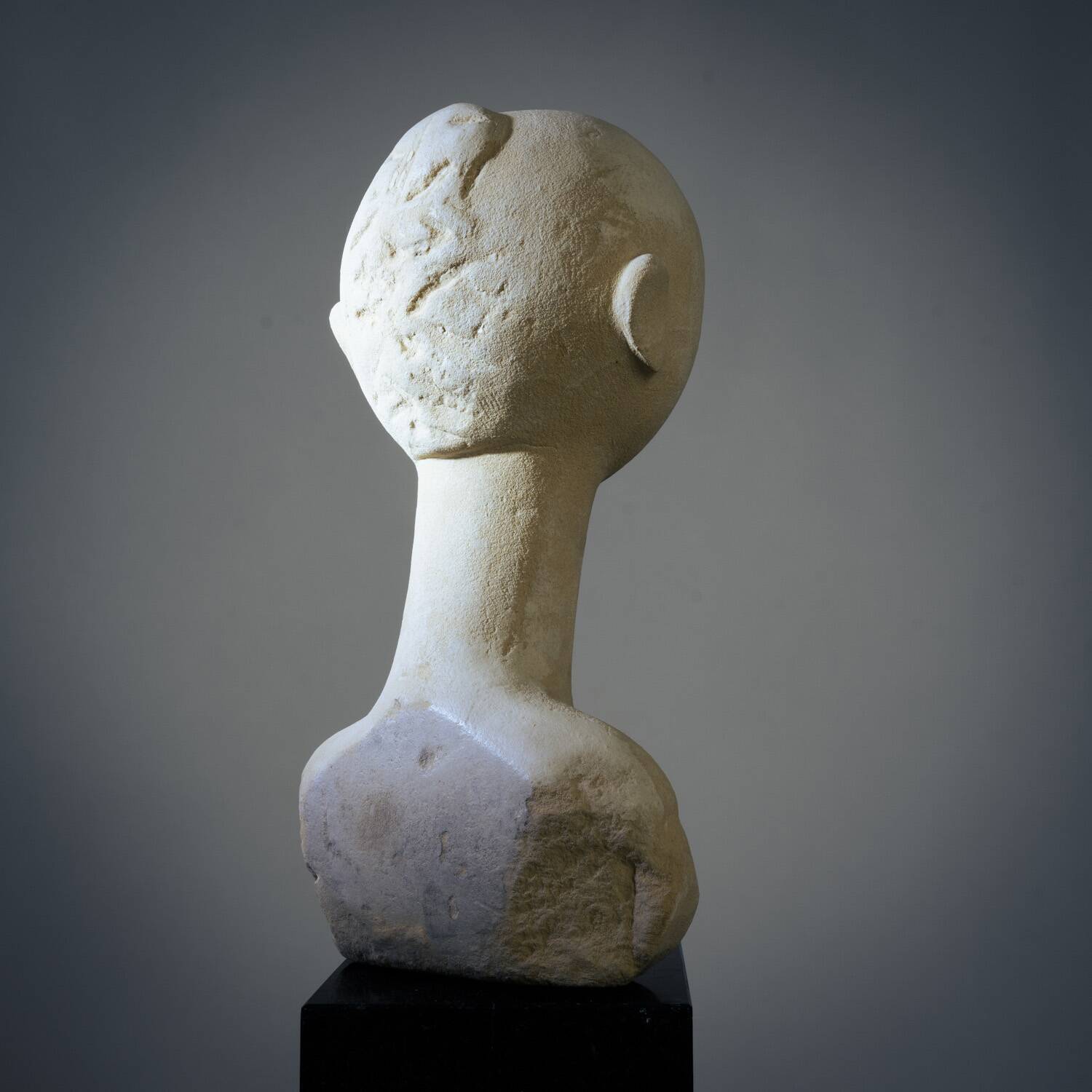 Modernist bust sculpture of a woman in sandstone