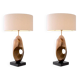 Pair of table lamps in patinated brass and black granite base.