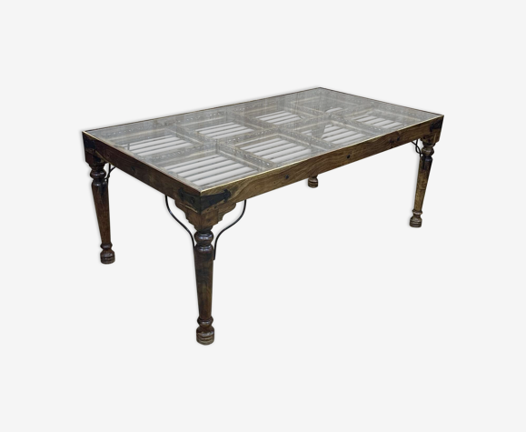 Table en teck et fer forgé avec un plateau verre