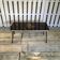 Vintage black and gold glass coffee table with conical legs from the 1940s.