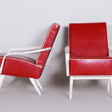 Red Leather mid Century Armchairs made in 1950s Czechia. Restored beech.