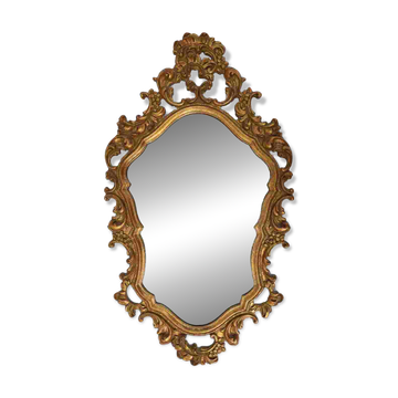 Baroque style oval wall mirror in gilded wood, France