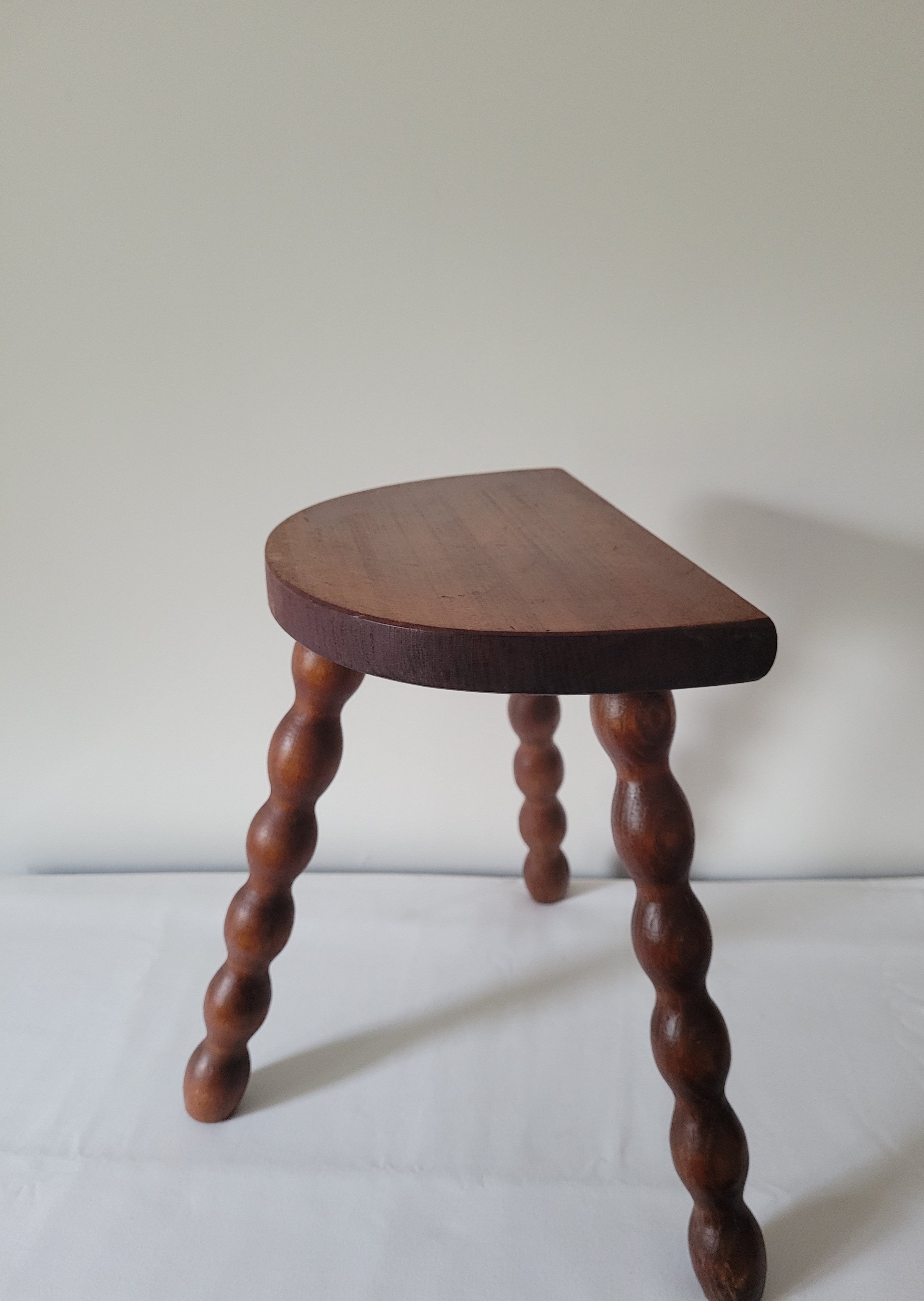 Brutalist stool turned wooden feet