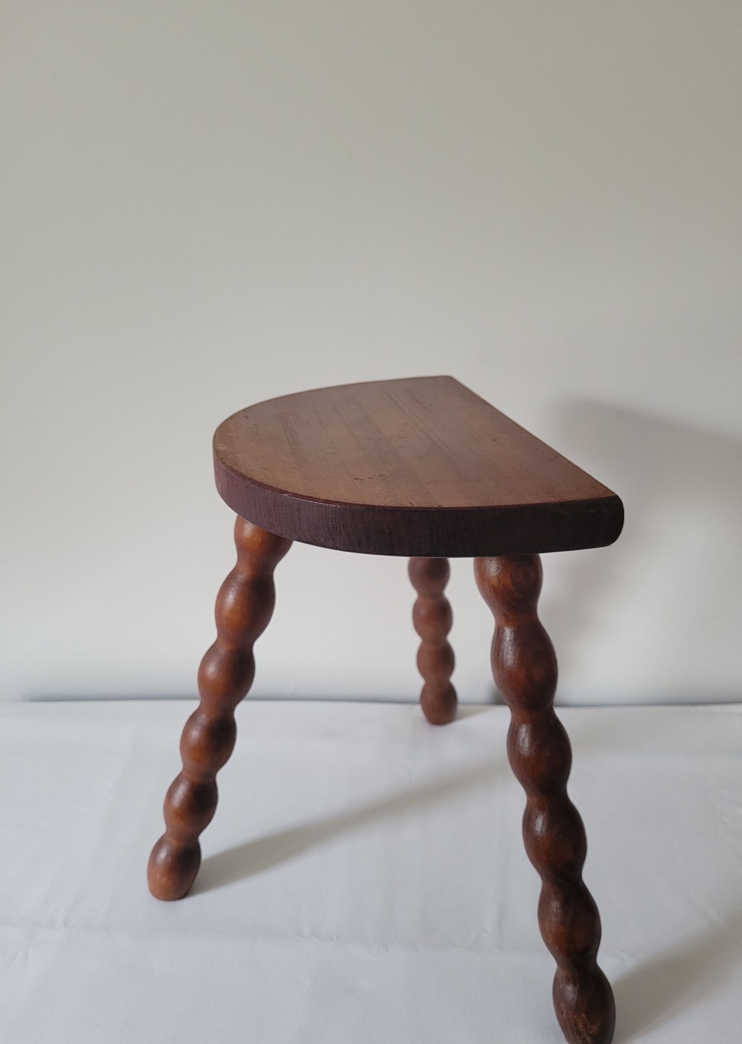 Brutalist stool turned wooden feet