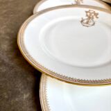 6 flat plates in gold porcelain monogrammed "F"