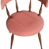 Pink gondola armchair in the style of Helmut.