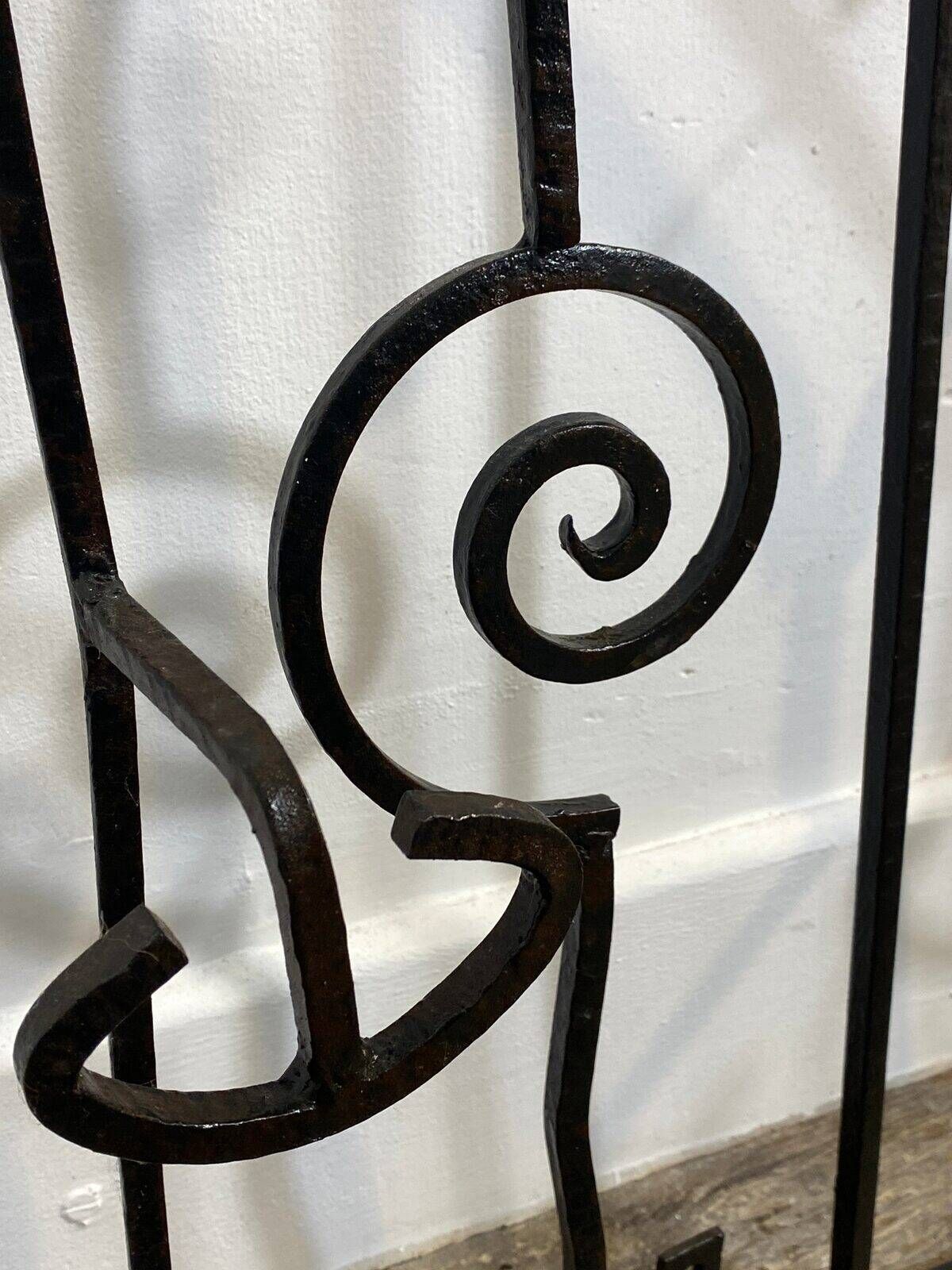 Wall-mounted coat rack in wrought iron, early 20th century