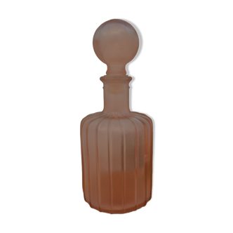 Bottle of perfume pink glass