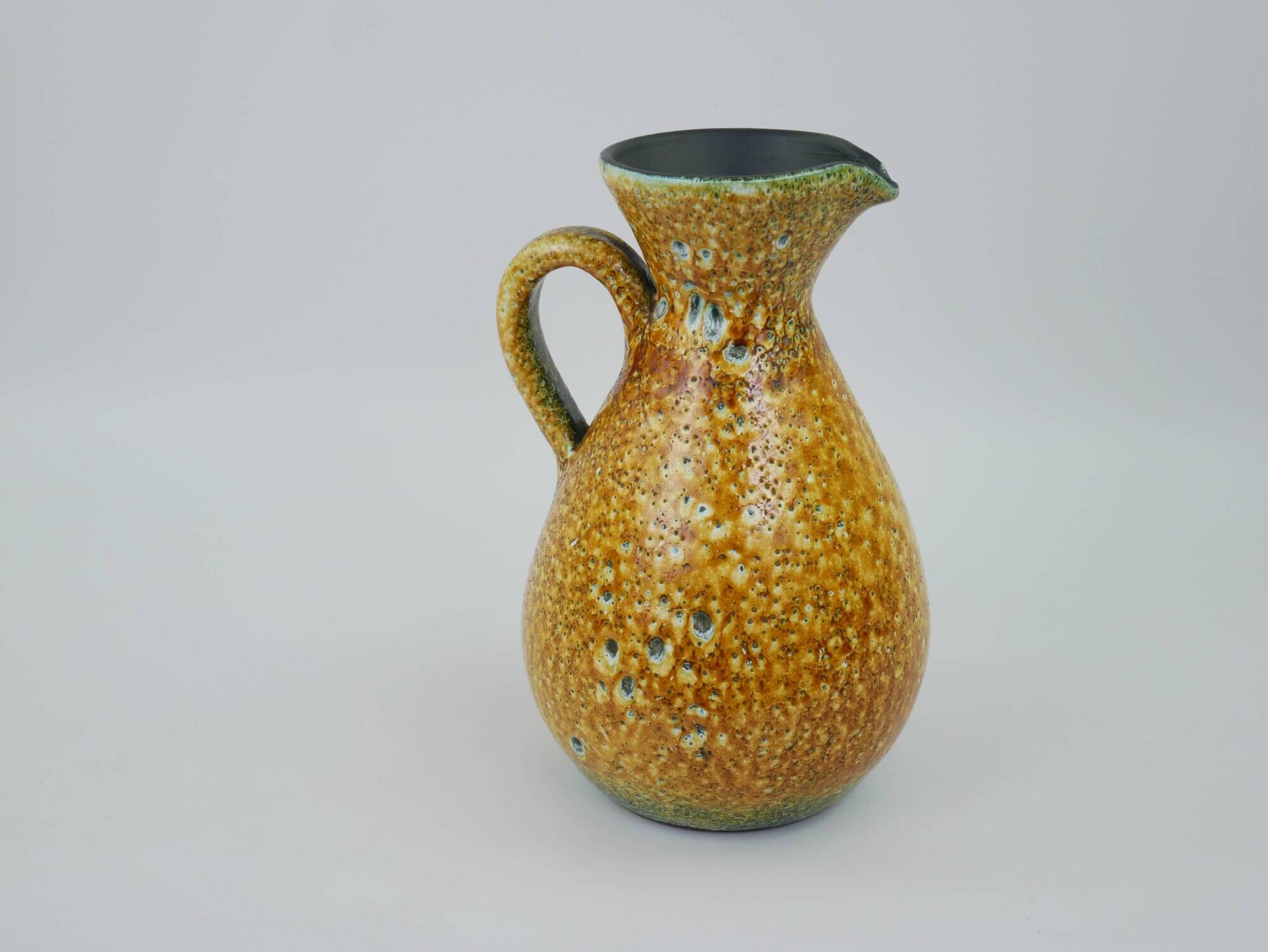 Large yellow ceramic pitcher in the Accolay style