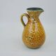 Large yellow ceramic pitcher in the Accolay style