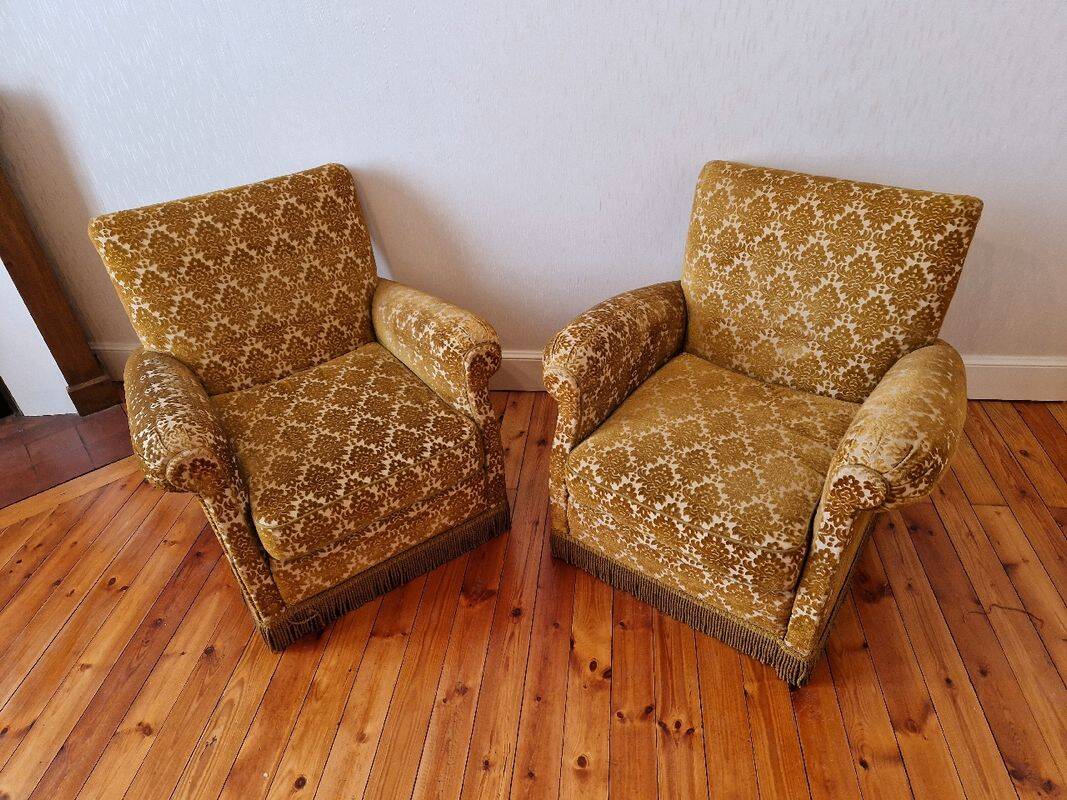 Pair of golden fringed armchairs
