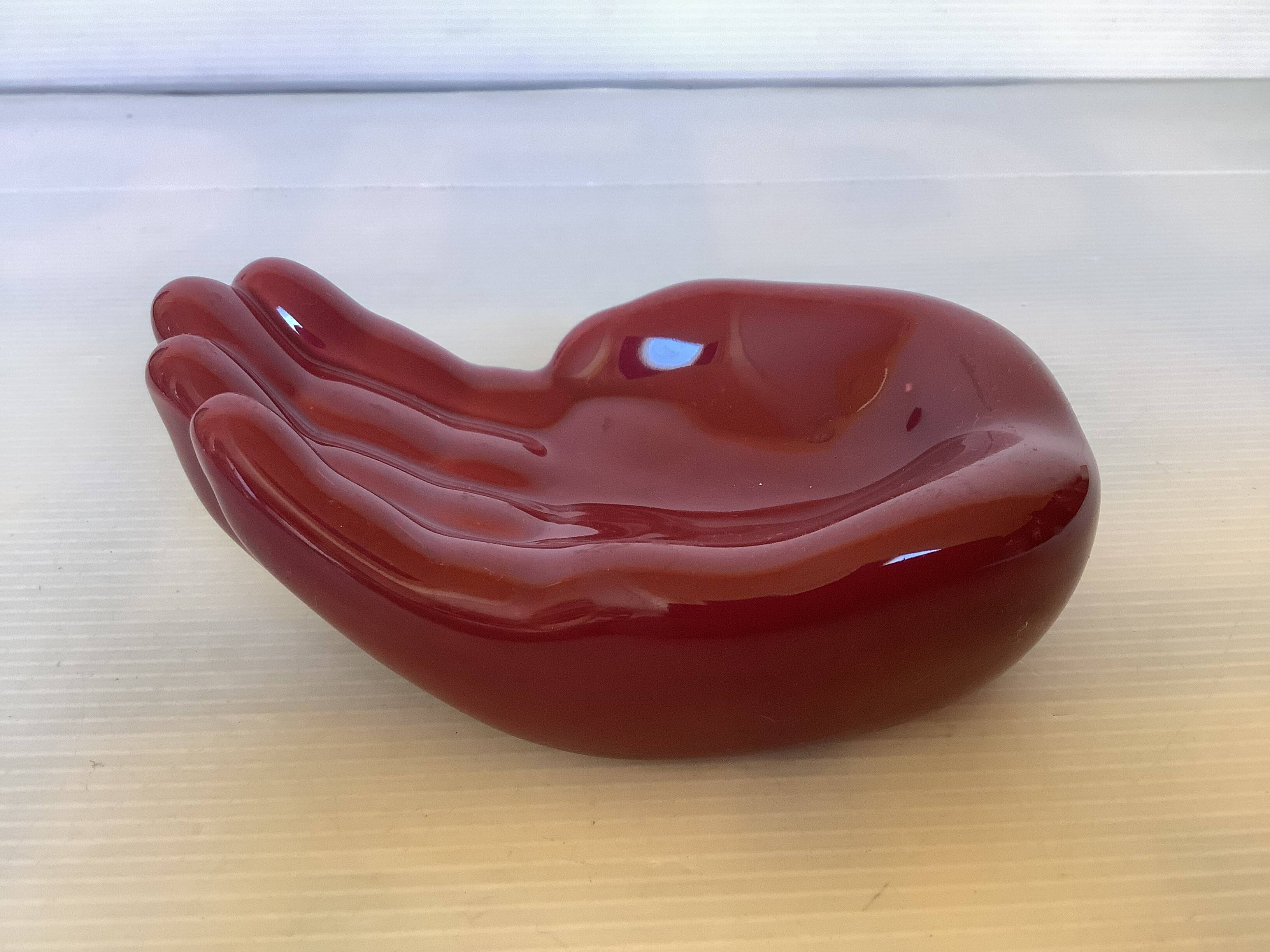 Burgundy hand emptier