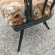 Pair of hand-carved armchairs in black lacquer and fur, 1920s.