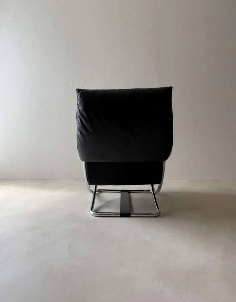 Swiss lounge chair with ottoman by Robert Haussmann from the 1980s.