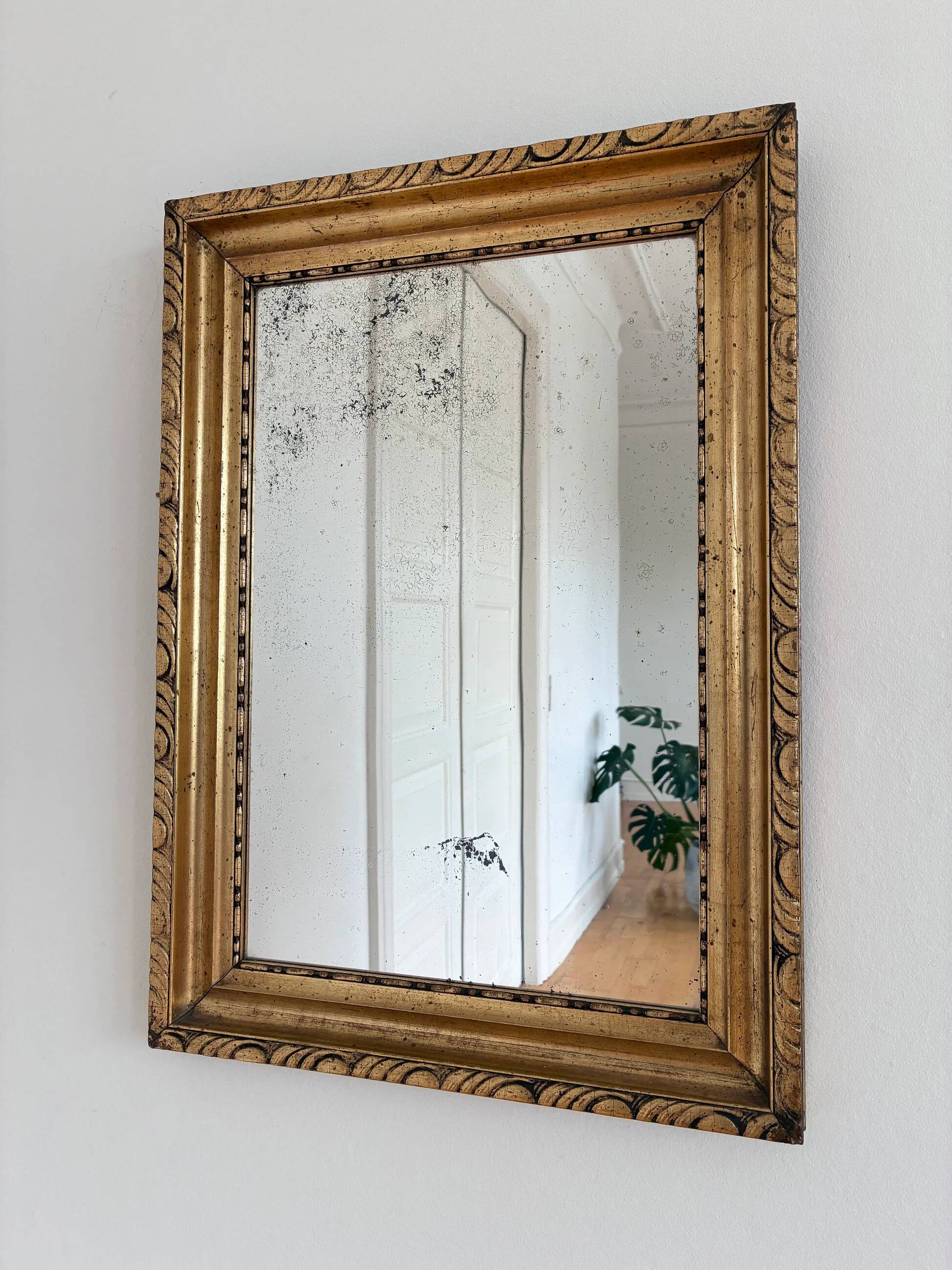 Antique French giltwood wall mirror in gold